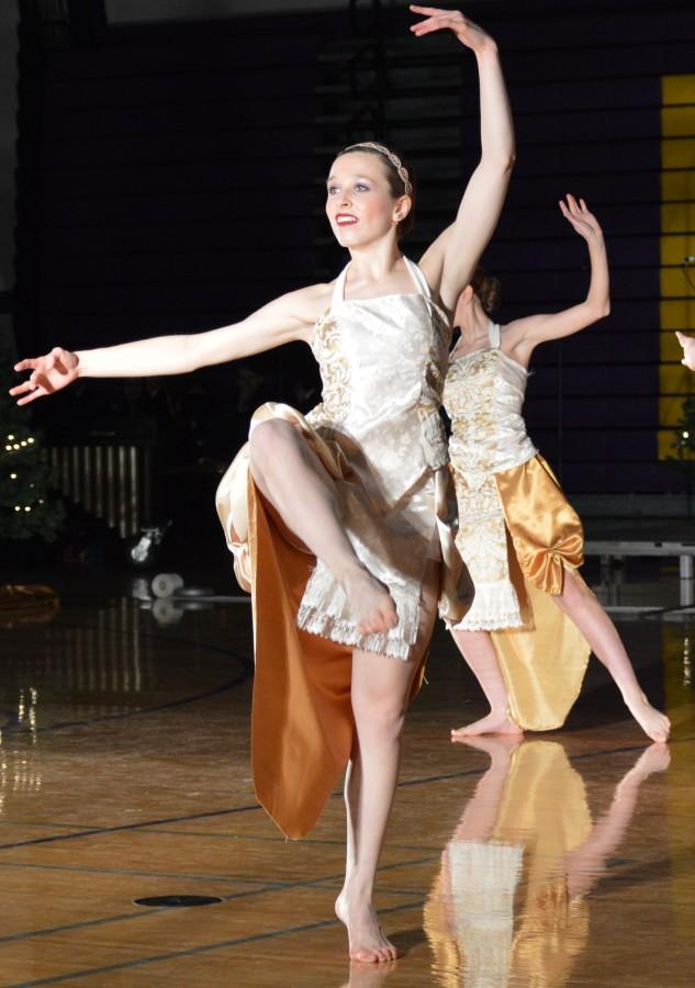 Senior Megan Kudla performs with other Orchesis dancers at the Holiday Assemby.