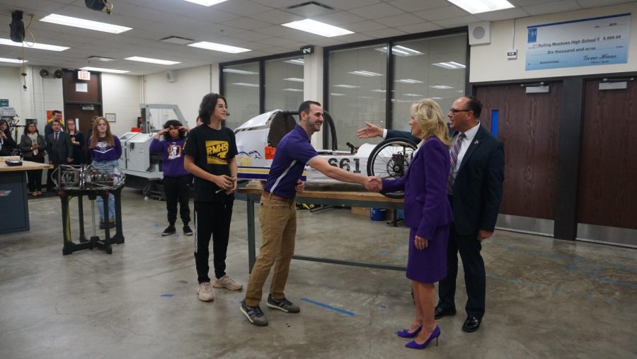 RMHS Engineering teacher, Anthony Genovese and Senior Manufacturing student, Omar Cabrera greet Dr. Jill Biden to speak upon their High Mileage Vehicle Project. 